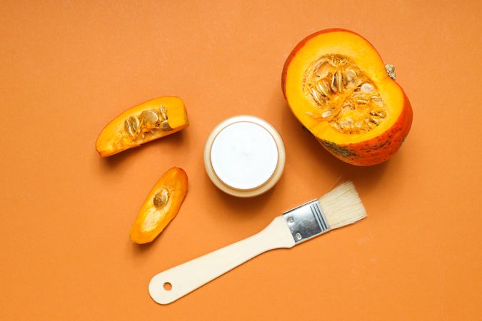 Skin care and face care concept - pumpkin cosmetic