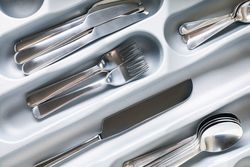 Set of different cutlery on whole background, close up