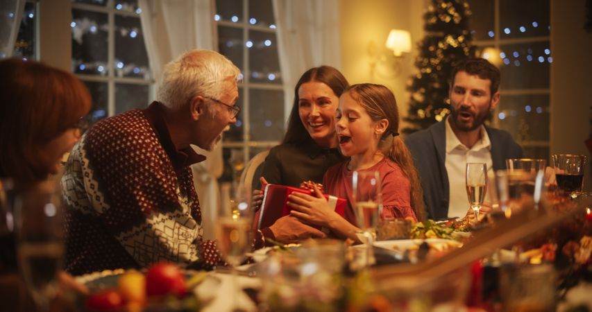 Big Diverse Family Exchanging Christmas Gifts to Celebrate the Holiday.