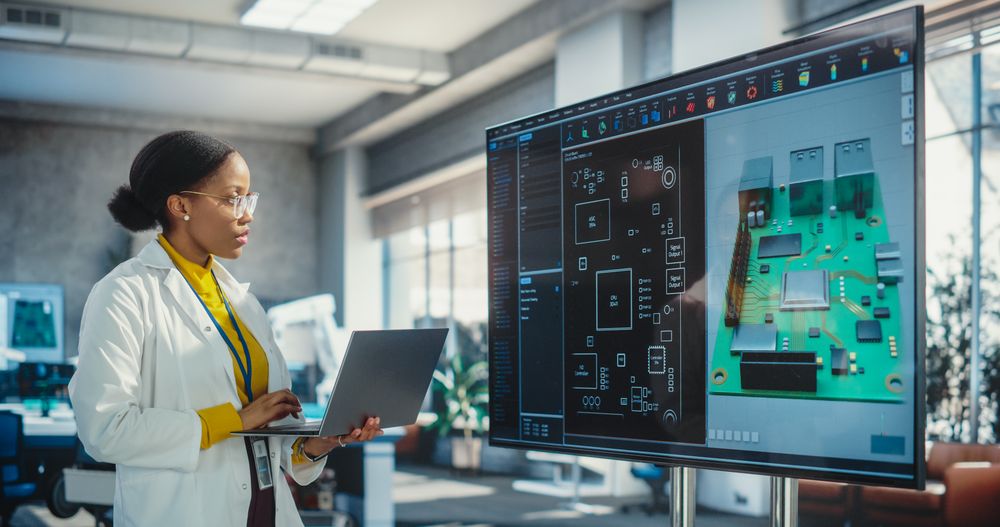 Portrait of Young Black Woman Working in a Lab of Industrial Startup.
