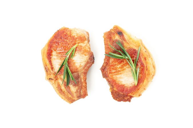 Fried pork steaks isolated on blank background. Grilled food
