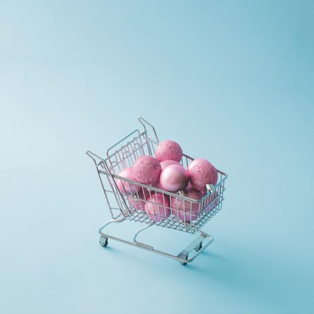 Shopping cart with pink Christmas decorations