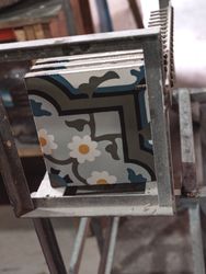 Decorative painted geometric ceramic tiles with ornaments on metal frame