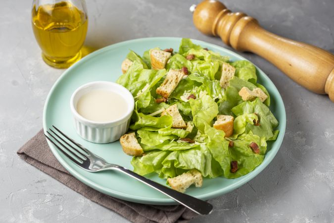 Caesar salad with croutons and bacon.