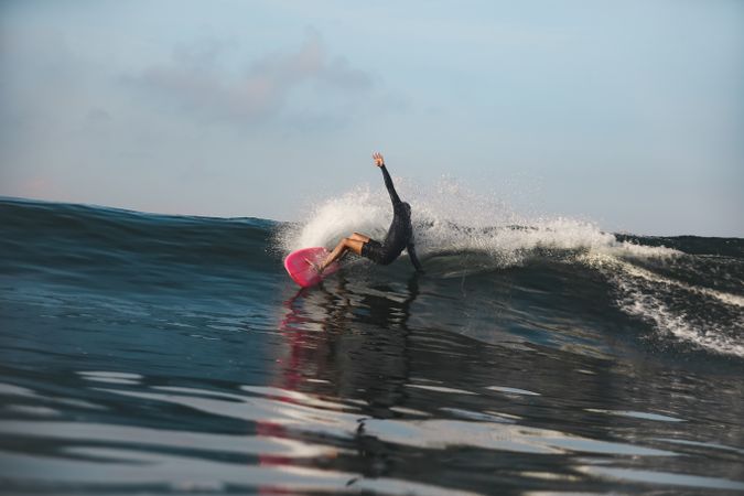 Man on surf board on waving water