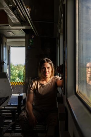 Military woman travelling looking at camera