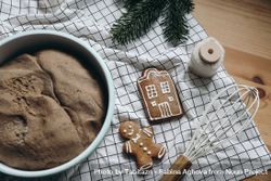 Gingerbread cookies, and cake with whisk on counter 5ROx24
