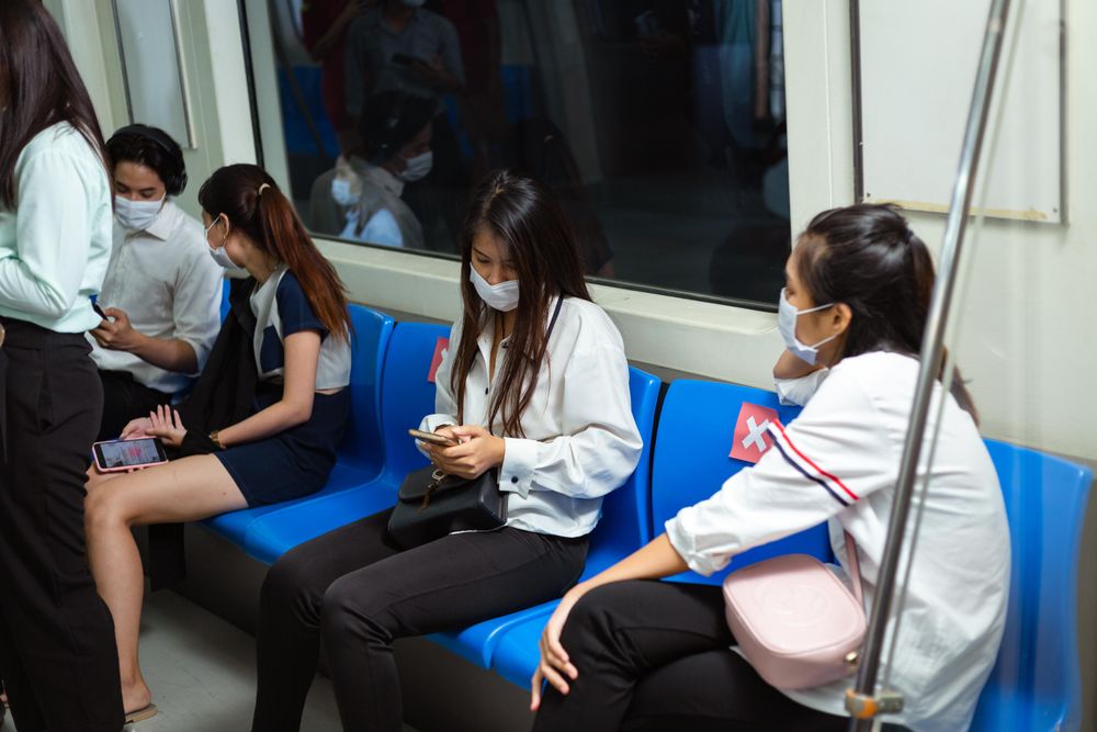Group of passengers sitting in a subway train