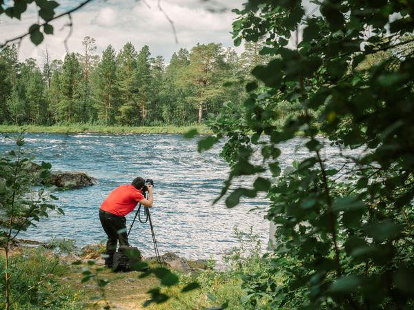 Man taking photo on riverside