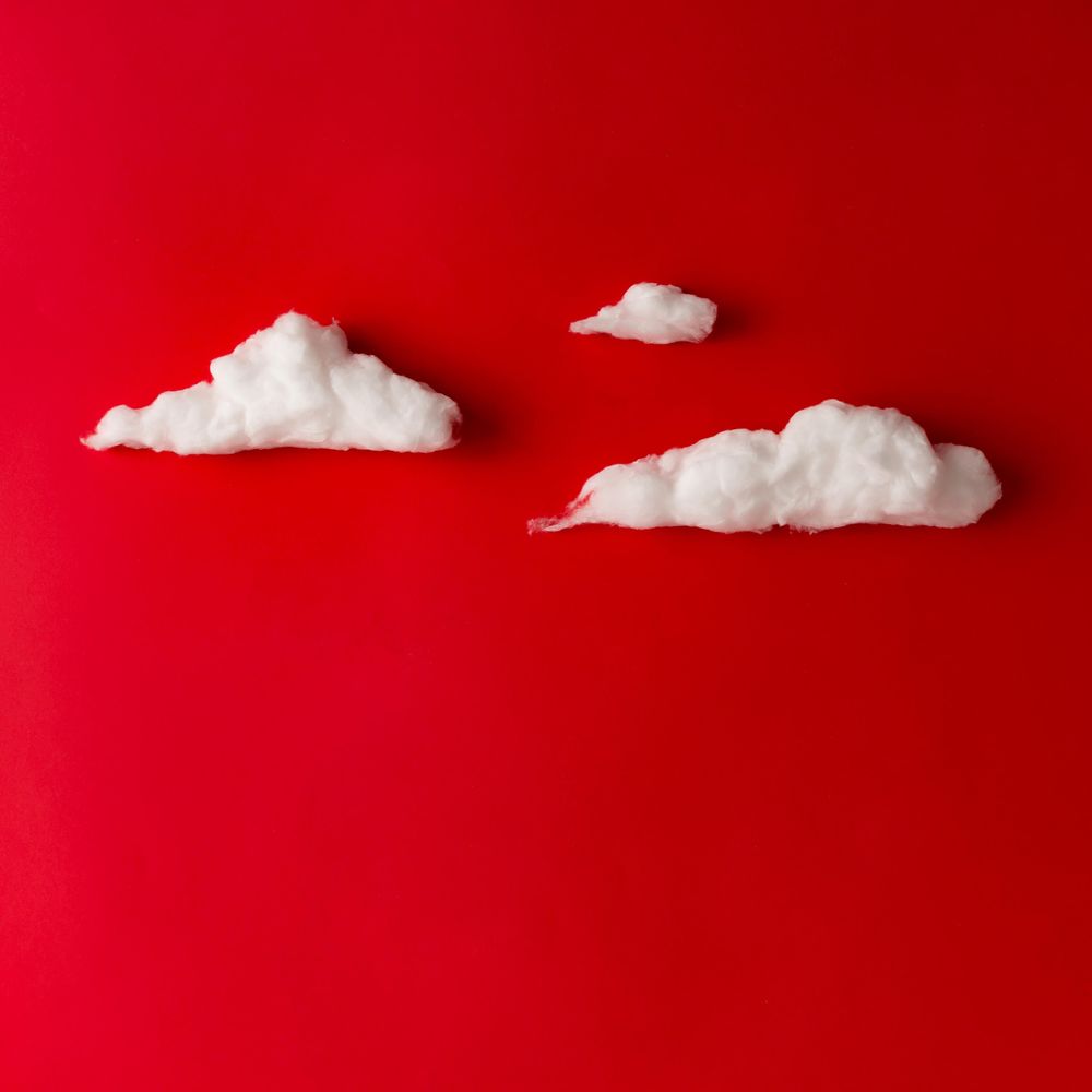 Clouds on red background