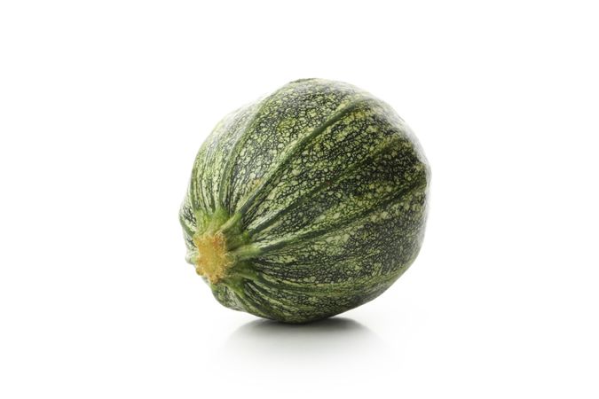 Fresh green zucchini isolated on blank background