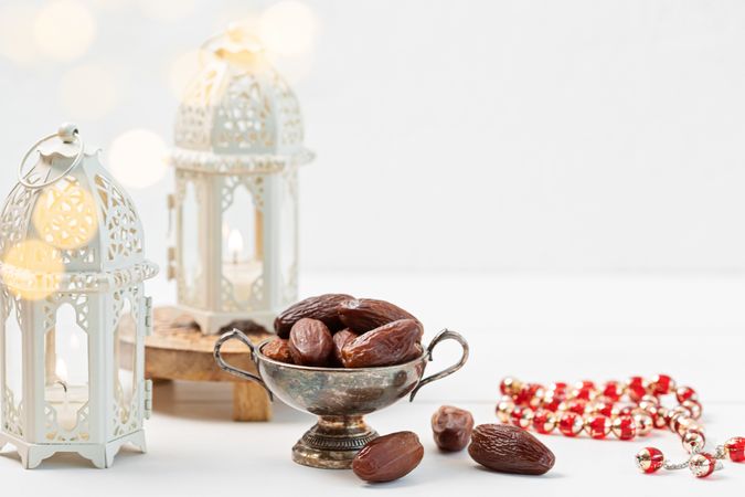 Traditional Ramadan Scene with Lanterns, Dates, and Prayer Beads