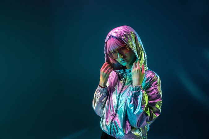 Woman standing in sparkly silver jacket