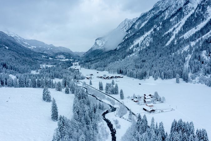 Snowy valley in the Bavarian Alps, winter drone aerial view in Oberstdorf, Germany