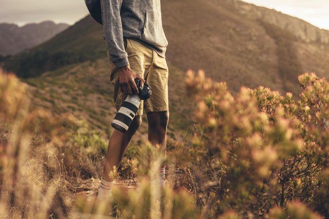 Photographer hiking in nature for new content for his social media
