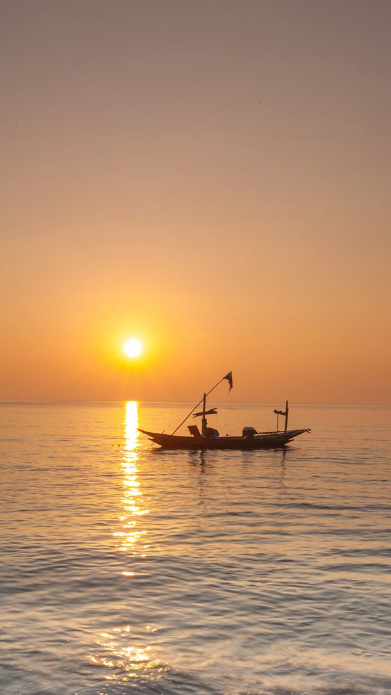 Boat Silhouette When Sunrise