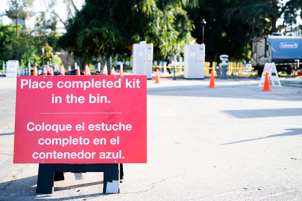 Sign with instructions for Covid testing site workers