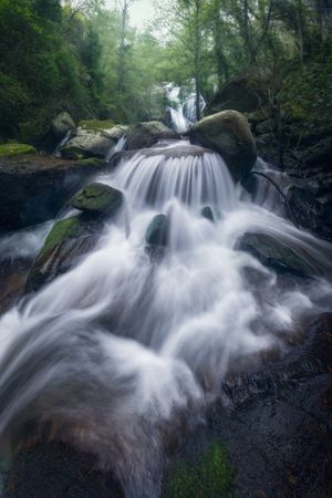 Majestic wild waterfall on rocks