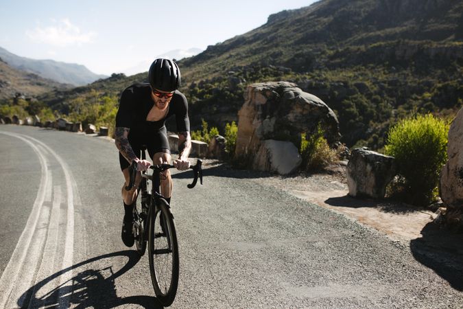 Cyclist exercising on pro bike outdoors
