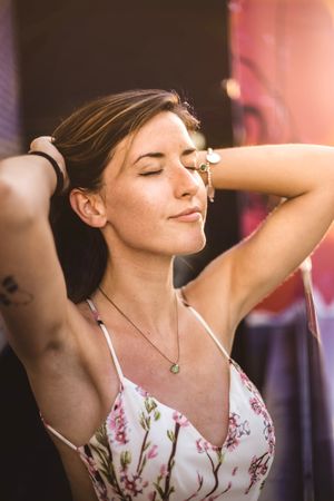 dreamy woman against sunny blurred background