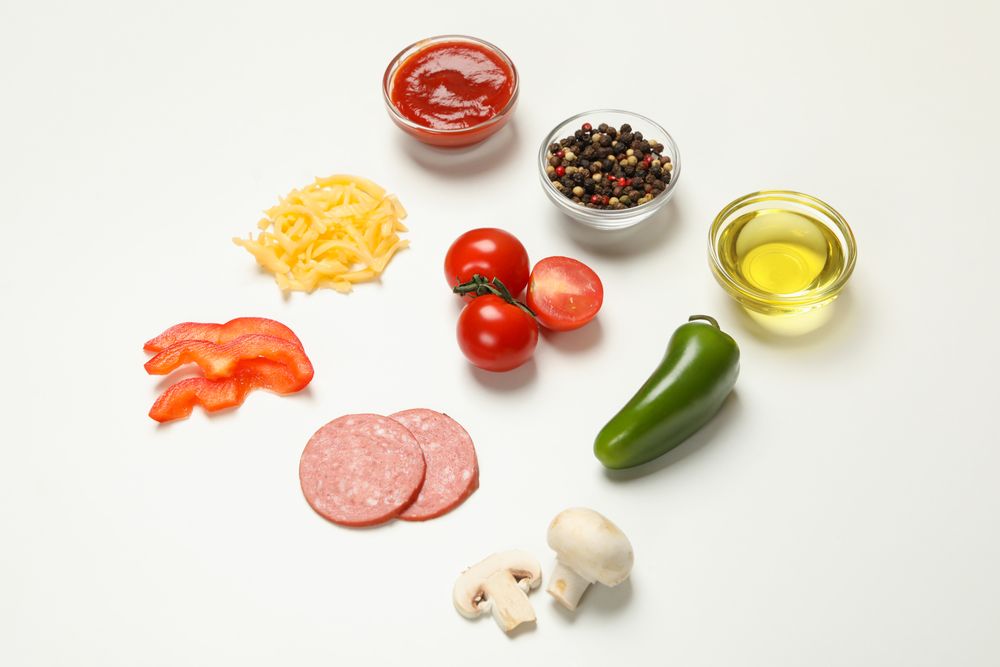 Ingredients for cooking pizza on blank background