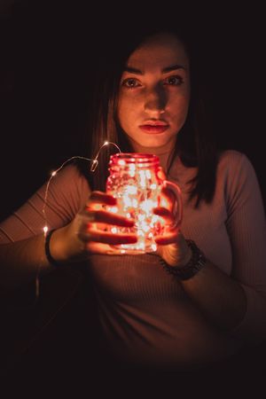 Woman in sunglasses with lamp