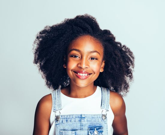 Portrait of smiling girl with curly hair