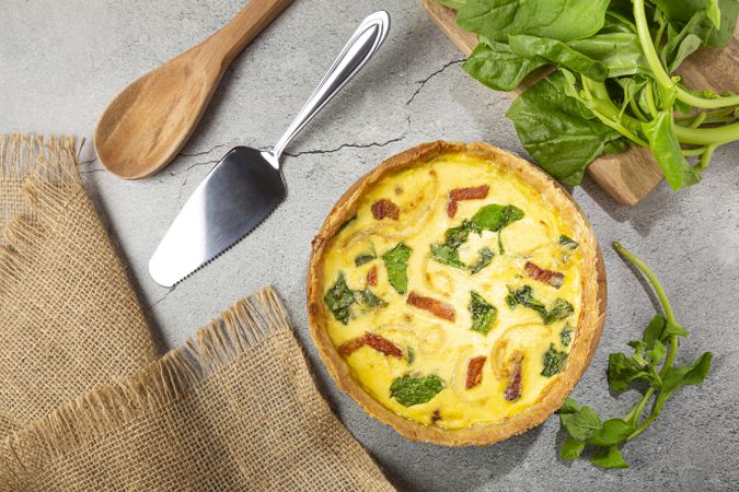 Spinach quiche with onion and bacon.