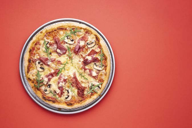 Prosciutto and arugula pizza top view