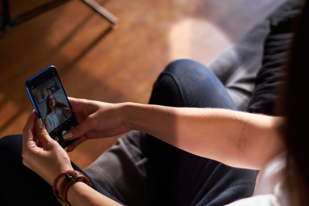 Woman talking a selfie on her phone