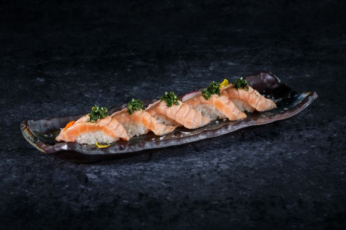 Delicious sushi served on plate in restaurant