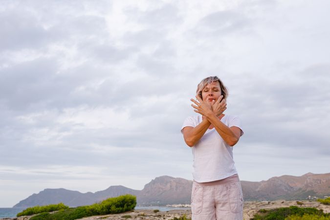 Adult woman doing breathing exercise