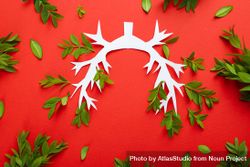 Lung bronchus on red background with ribbon and green foliage 0PrOv4