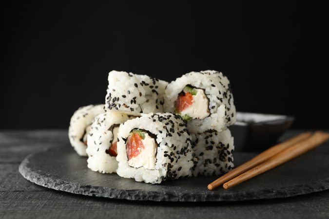 Tray with delicious sushi rolls, close up. Japanese food