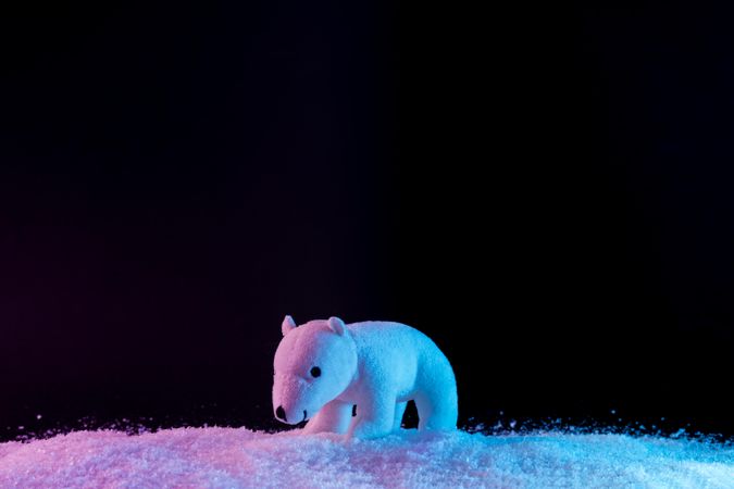 Polar bear on vibrant bold gradient holographic colors on snow