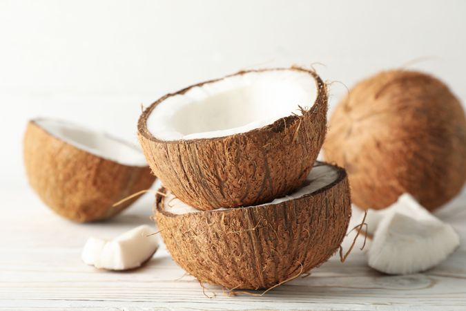 Coconut on wooden background, close up. Tropical fruit