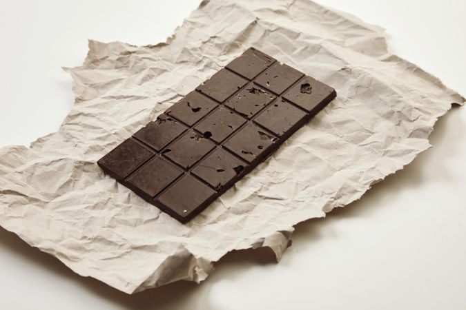 Full bar of artisan chocolate on craft paper