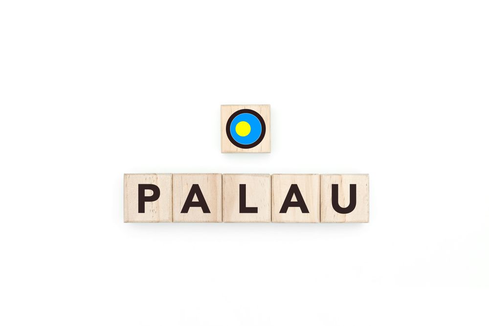 Wooden blocks bearing the name and flag of Palau.