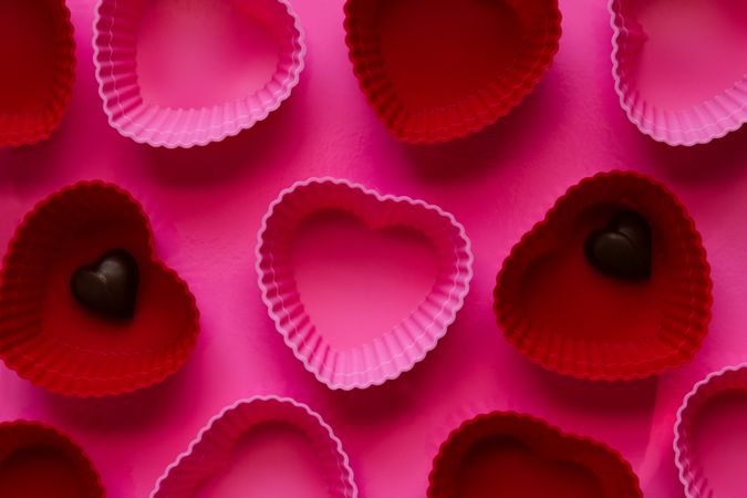 Pink and Red Hearts with Heart Chocolate on Pink Background