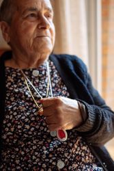 mature woman with personal alarm hanging from the neck