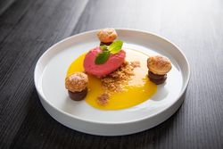 Raspberry ice cream with curable oranges chocolate and puff pastry