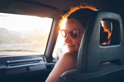 Young woman traveling in car