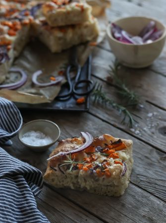 Pieces of fresh focaccia on wooden table