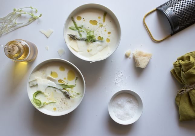Kitchenware and condiments near asparagus cream soup