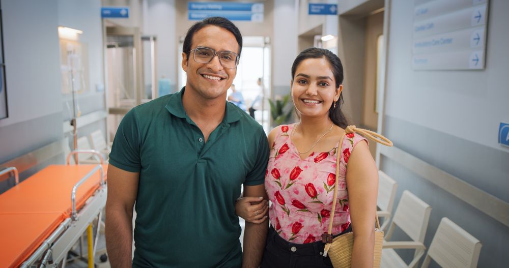 Happy Male and Female Patients Satisfied with Healthcare Service Provided by Modern Local Medical Clinic