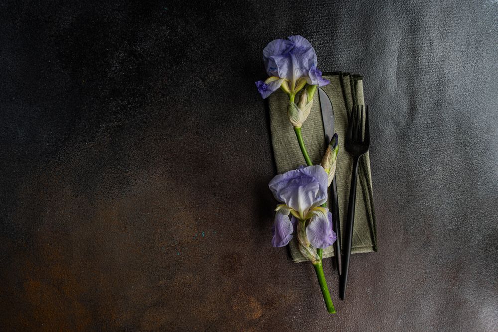 Table setting with pale blue iris flowers