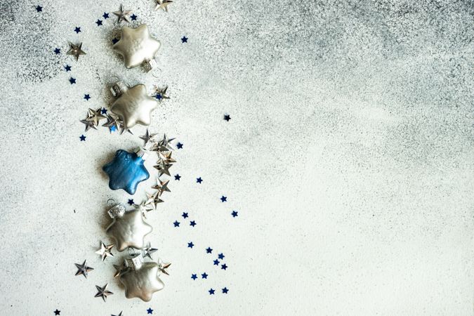 Festive Christmas card concept with silver and blue star shaped decor
