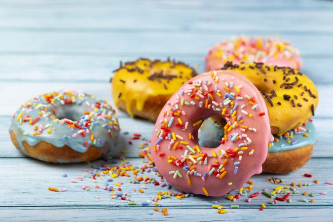 Delicious assorted colorful donuts on the table.