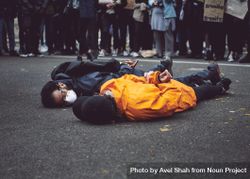 London, England, United Kingdom - June 6th, 2020:  Two men lay on ground with hands behind back 4MGpx0