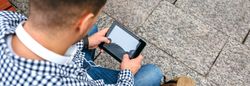 Unrecognizable man using tablet
